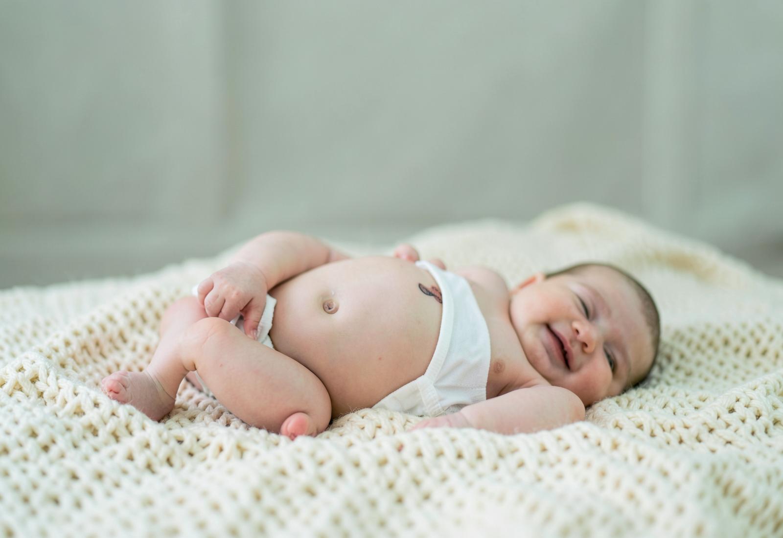 Baby wearing Soft Nest Care diapers